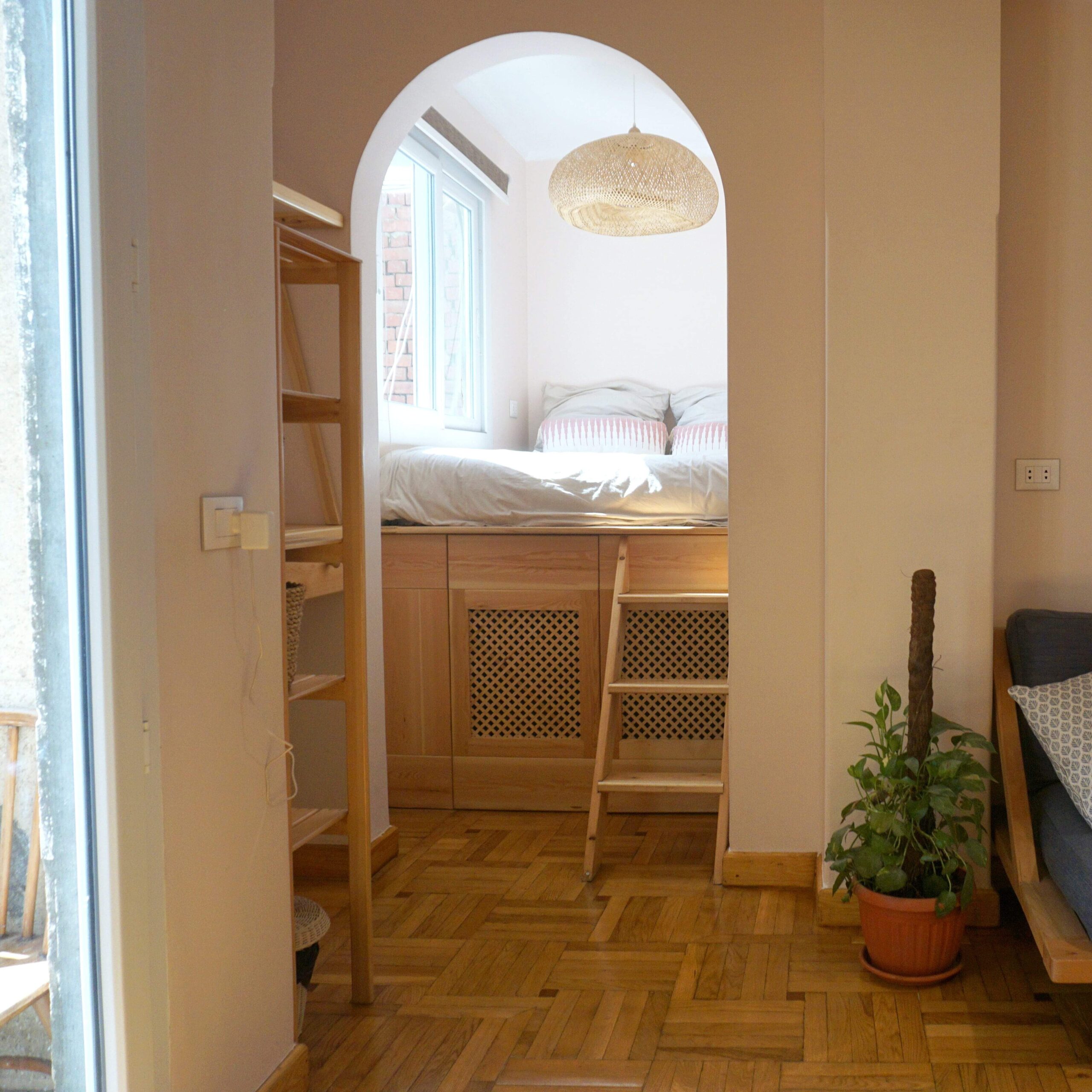 Studio apartment with private balcony and bathroom, living room and kitchenette.